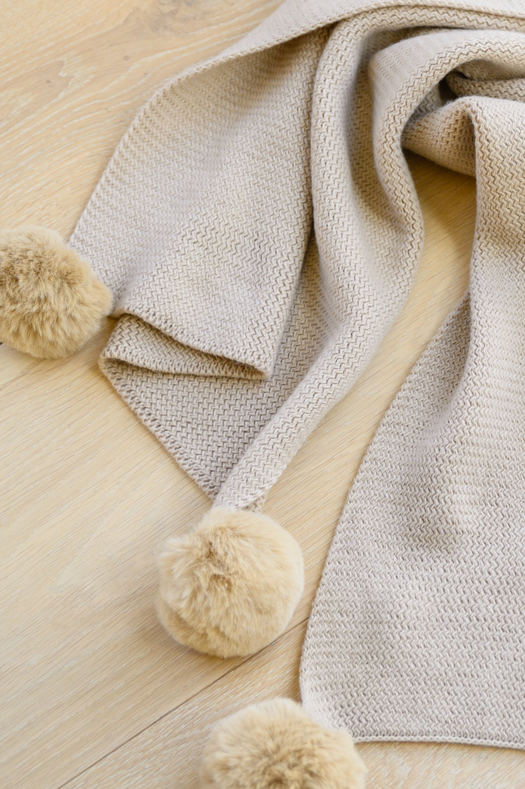 Warm Fuzzies Knitted Pom Pom Scarf In Beige