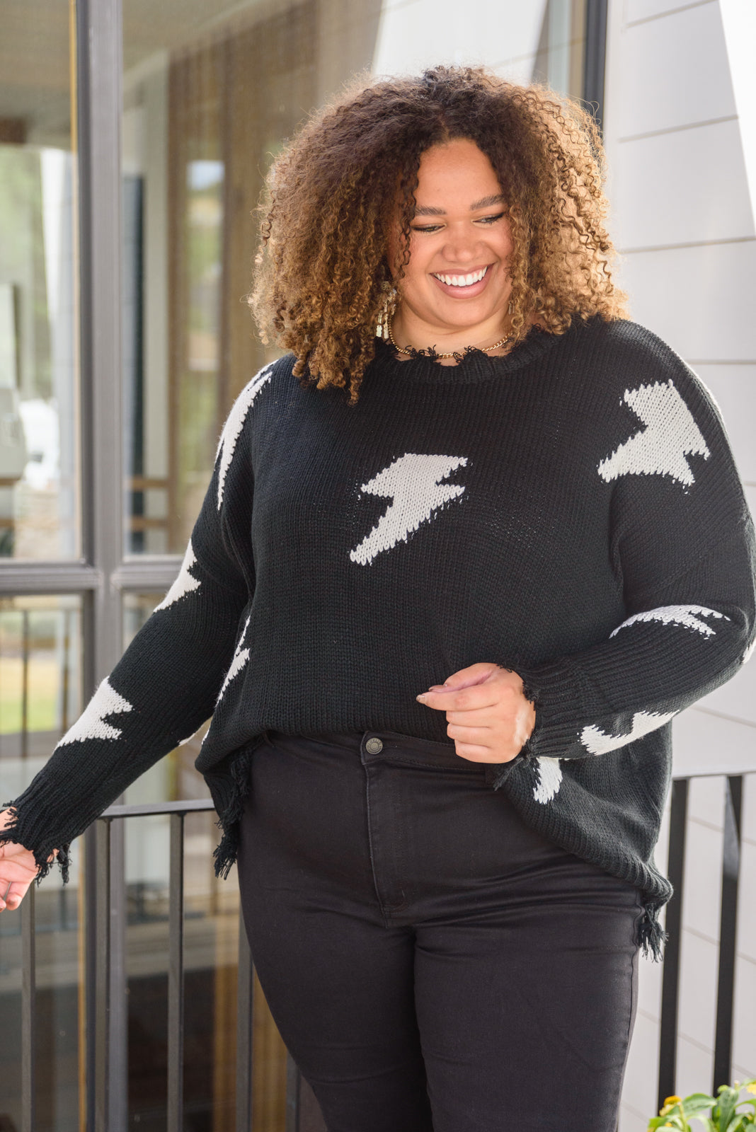 Flashy and Fierce Raw Hem Sweater in Black
