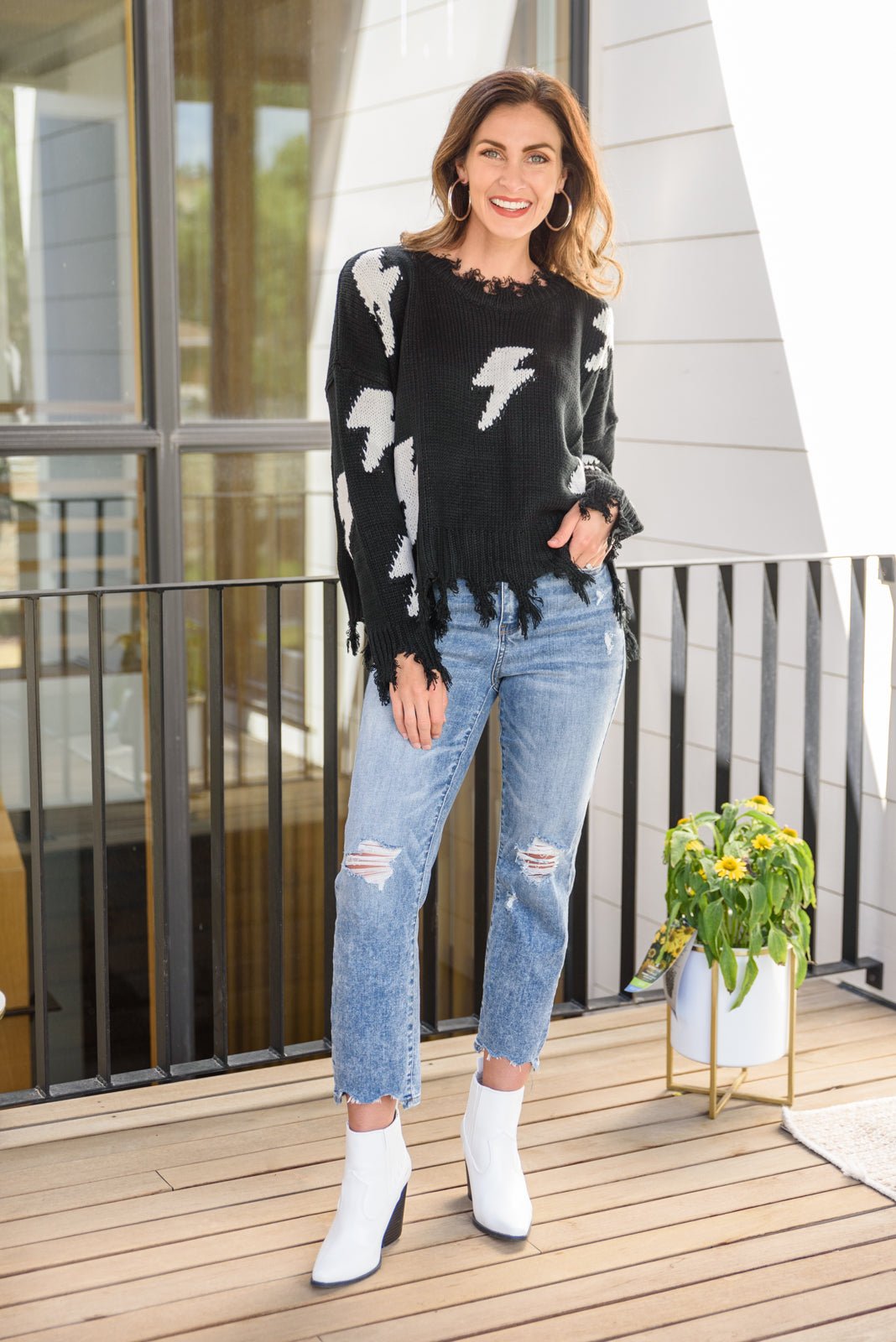 Flashy and Fierce Raw Hem Sweater in Black