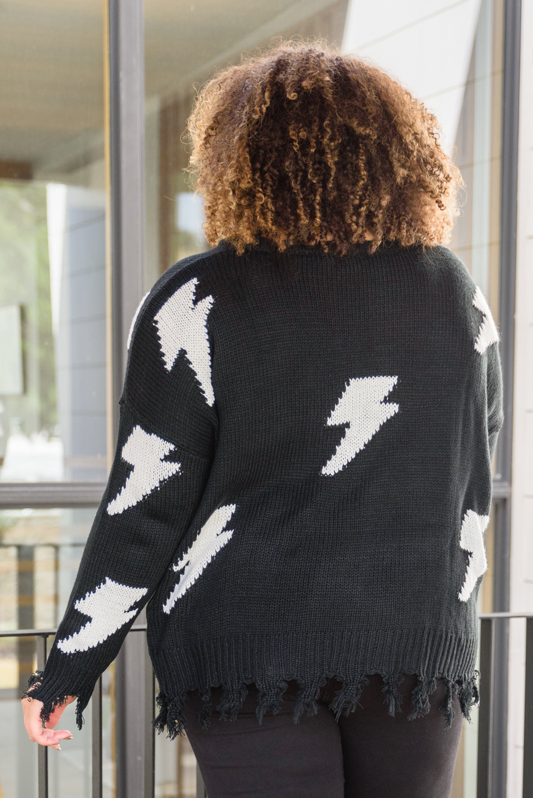 Flashy and Fierce Raw Hem Sweater in Black